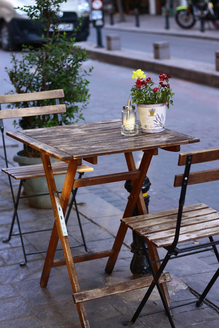 Charming wooden table setup on a quaint Istanbul street, perfect for outdoor dining.