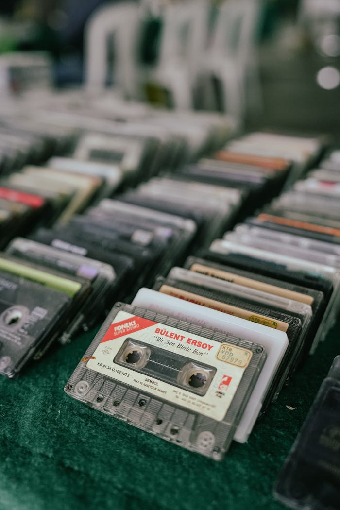 why-choose-us A collection of vintage cassette tapes on display, showcasing retro music culture.